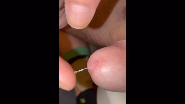 Just the tip of my cock edging precum leaking piss slit