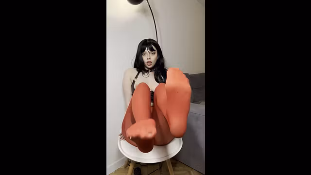 Thick legs spread wide on the chair