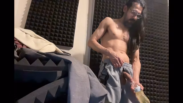 heavy 9 inch cock pissing in bottle cock and balls coming out of crotch of greysweat pants