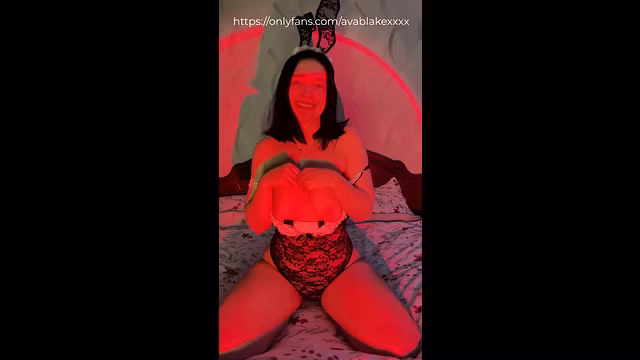 Sitting on the bed in black lace bunny bodysuit, I pull it down exposing my tits and play with them while smiling at you 😈💦 Full uncensored on OnlyF