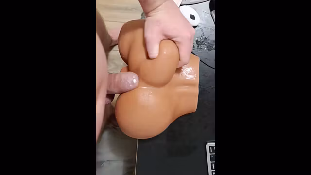 Condom Dick Fucks a Toy-Ass and Cums