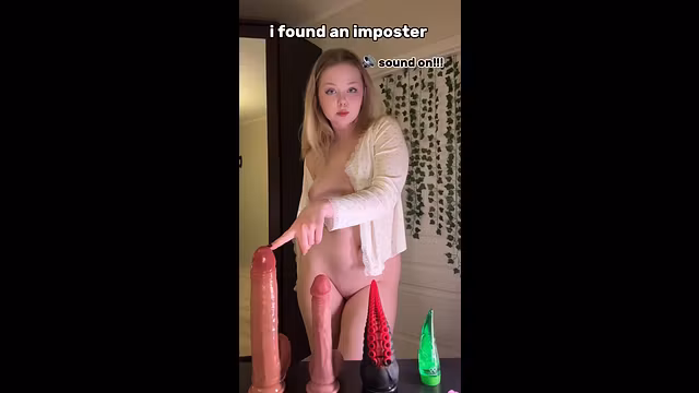 Blonde bends forward, tits swaying over toys 💘