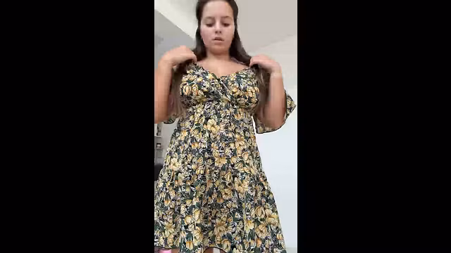 She pulls her dress down slow and teases